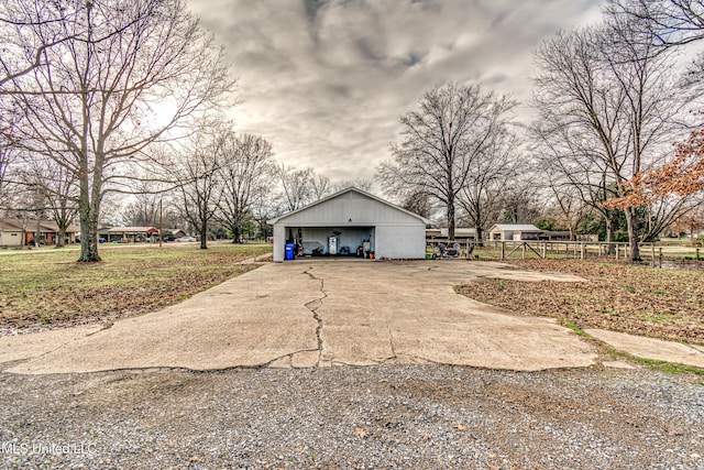 exterior space featuring a garage and an outdoor structure