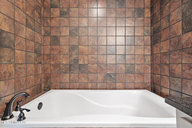 bathroom featuring a washtub