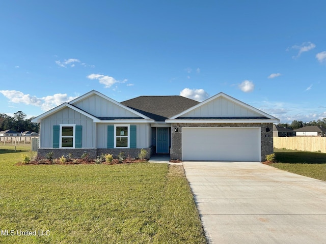 view of front of home featuring a front lawn and a garage