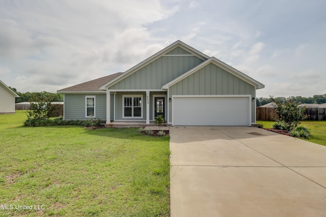 113 Magnolia Farms Dr, Lucedale, MS 39452 - view of front of house with board and batten siding, an attached garage, driveway, and a shingled roof