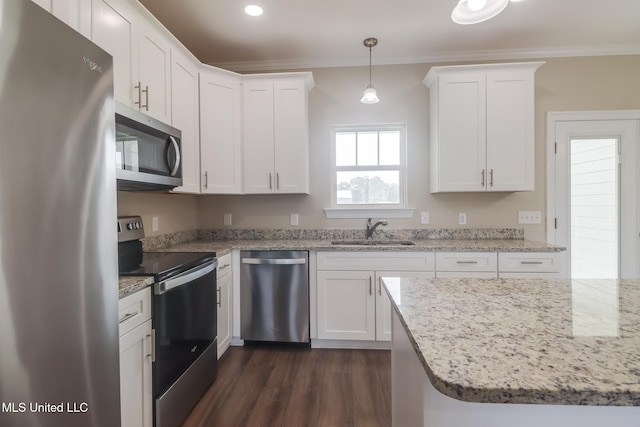 113 Magnolia Farms Dr, Lucedale, MS 39452 - kitchen with appliances with stainless steel finishes, a sink, ornamental molding, white cabinets, and dark wood-style flooring