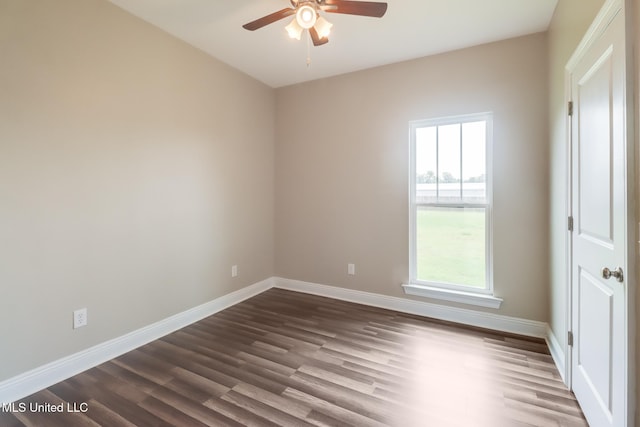 113 Magnolia Farms Dr, Lucedale, MS 39452 - unfurnished room featuring a ceiling fan, healthy amount of natural light, dark wood-style floors, and baseboards