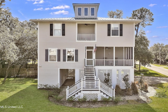 view of front facade with covered porch and a front lawn