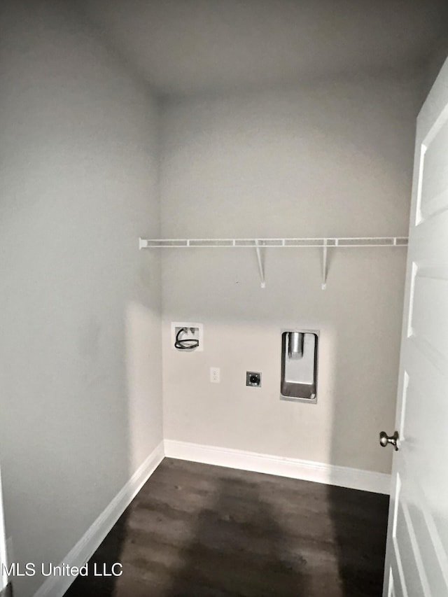 laundry area with hookup for an electric dryer, laundry area, dark wood finished floors, and baseboards