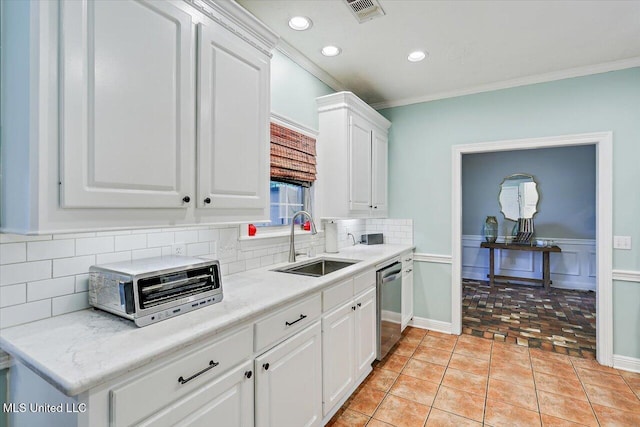 501 Brighton Cir, Brandon, MS 39047 - kitchen with a sink, dishwasher, backsplash, ornamental molding, and white cabinets