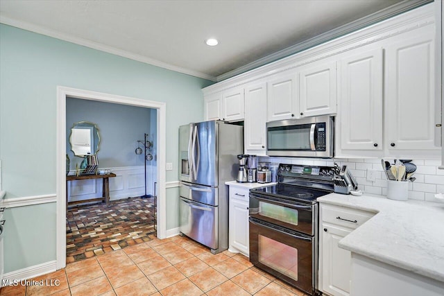 501 Brighton Cir, Brandon, MS 39047 - kitchen with stainless steel appliances, crown molding, backsplash, white cabinets, and recessed lighting