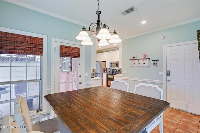 501 Brighton Cir, Brandon, MS 39047 - dining area featuring a chandelier, light tile patterned floors, ornamental molding, and recessed lighting