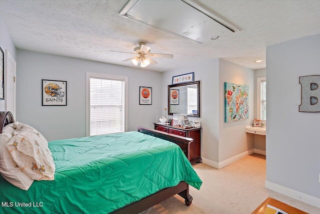 501 Brighton Cir, Brandon, MS 39047 - bedroom with a textured ceiling, light colored carpet, attic access, baseboards, and ceiling fan