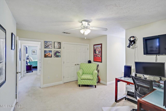 501 Brighton Cir, Brandon, MS 39047 - office area featuring light carpet, ceiling fan, baseboards, and a textured ceiling