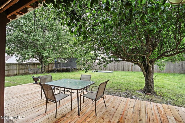 501 Brighton Cir, Brandon, MS 39047 - deck with a trampoline and outdoor dining area