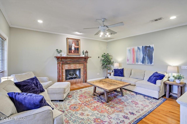 501 Brighton Cir, Brandon, MS 39047 - living area with light wood-style flooring, ceiling fan, a fireplace, ornamental molding, and recessed lighting
