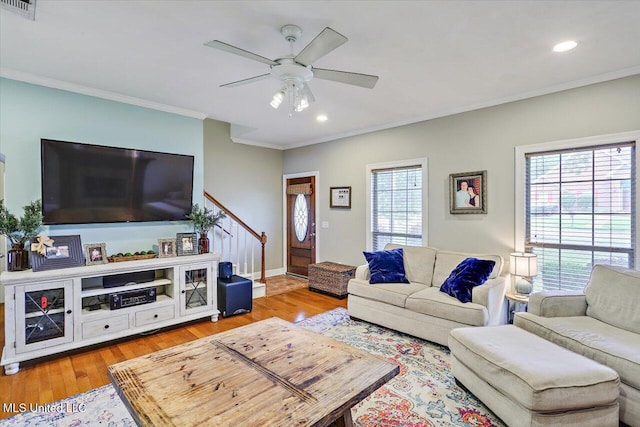 501 Brighton Cir, Brandon, MS 39047 - living room featuring plenty of natural light, crown molding, a ceiling fan, light wood-type flooring, and recessed lighting