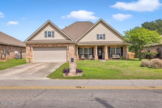 craftsman house featuring covered porch, brick siding, and driveway