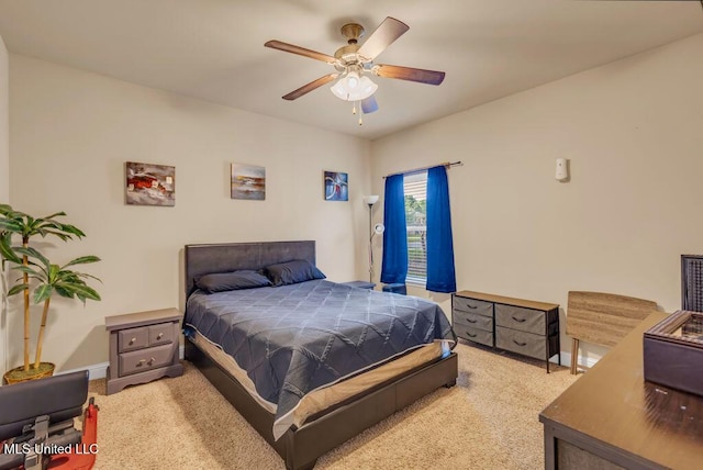 carpeted bedroom featuring baseboards and ceiling fan