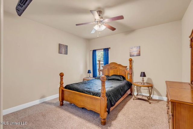 bedroom with baseboards, light carpet, and ceiling fan