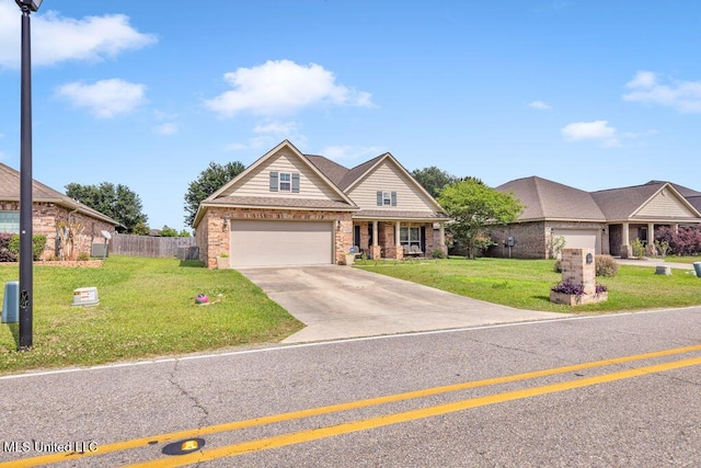 craftsman inspired home with brick siding, fence, driveway, and a front yard