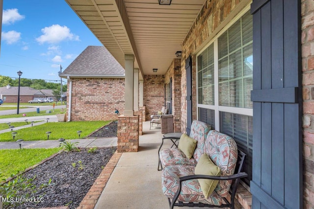 view of patio featuring a porch