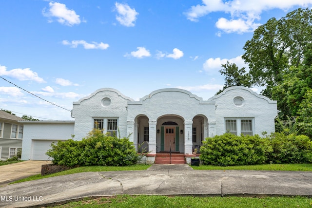 2418 24th Ave, Meridian, MS 39301 - view of front facade featuring an attached garage, concrete driveway, and brick siding