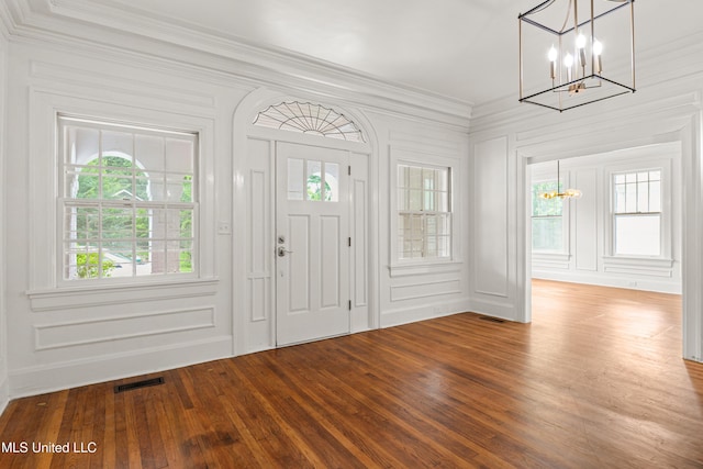 2418 24th Ave, Meridian, MS 39301 - foyer with a chandelier, ornamental molding, wood finished floors, and a decorative wall
