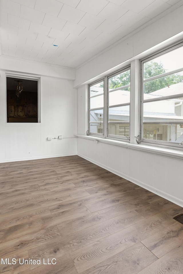 2418 24th Ave, Meridian, MS 39301 - spare room featuring wood finished floors and healthy amount of natural light