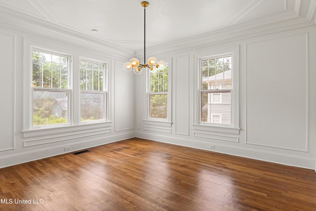 2418 24th Ave, Meridian, MS 39301 - spare room with a decorative wall, ornamental molding, a chandelier, and wood finished floors