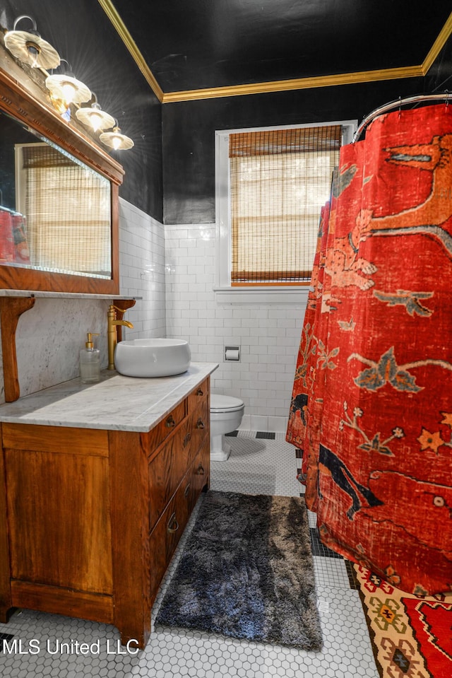 2418 24th Ave, Meridian, MS 39301 - full bath featuring vanity, tile patterned floors, toilet, ornamental molding, and tile walls