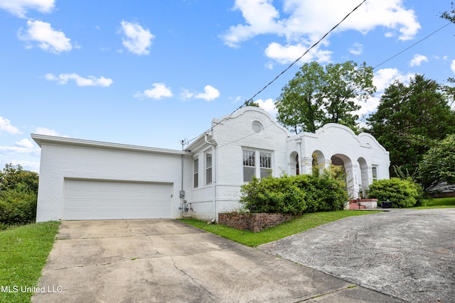 2418 24th Ave, Meridian, MS 39301 - view of front of home with driveway, an attached garage, and brick siding