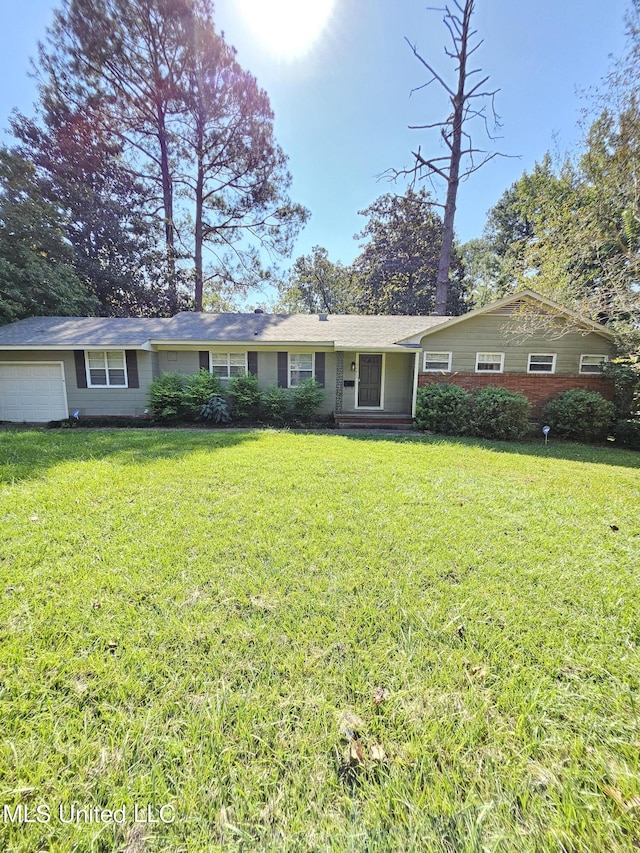 ranch-style house with a garage and a front yard