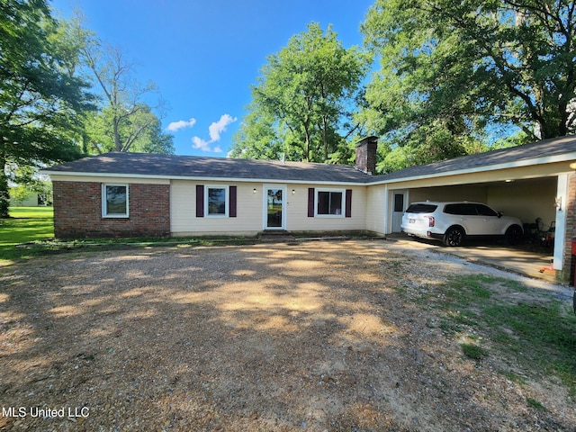 1365 Bruister Rd, Tutwiler, MS 38963 - single story home featuring a chimney, an attached carport, driveway, and brick siding