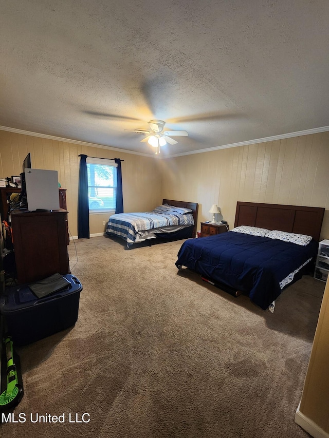 1365 Bruister Rd, Tutwiler, MS 38963 - bedroom with ornamental molding, carpet flooring, a textured ceiling, wood walls, and ceiling fan
