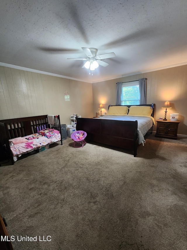1365 Bruister Rd, Tutwiler, MS 38963 - bedroom with carpet flooring, ornamental molding, a textured ceiling, wooden walls, and ceiling fan