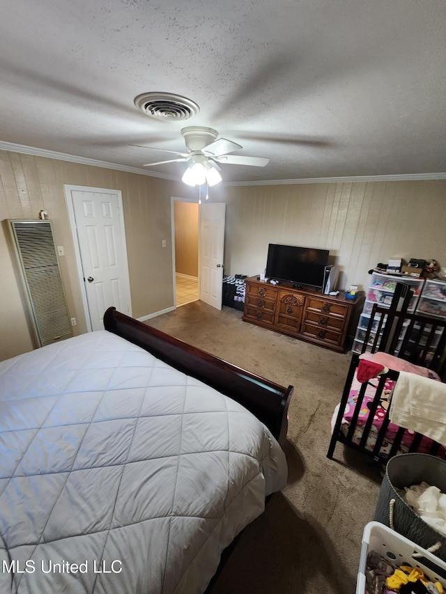 1365 Bruister Rd, Tutwiler, MS 38963 - carpeted bedroom featuring crown molding, a ceiling fan, a heating unit, a textured ceiling, and wooden walls