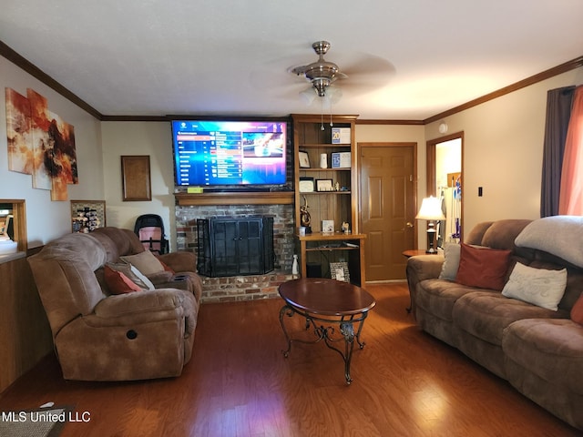 1365 Bruister Rd, Tutwiler, MS 38963 - living room with wood finished floors, a fireplace, ceiling fan, and crown molding