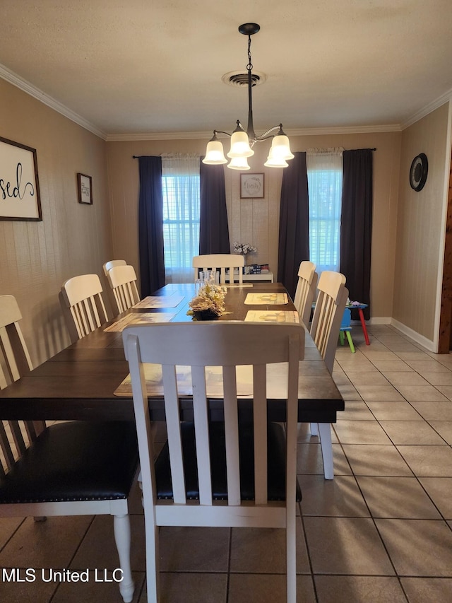 1365 Bruister Rd, Tutwiler, MS 38963 - dining area featuring crown molding, a chandelier, and light tile patterned floors