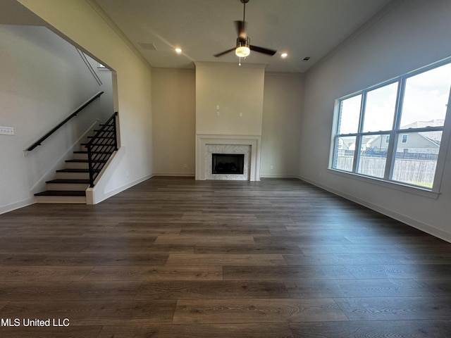 13721 River Grove Ln, Olive Branch, MS 38654 - unfurnished living room featuring ceiling fan, stairs, dark wood finished floors, a fireplace, and baseboards