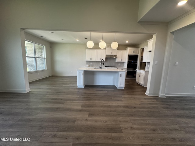 13721 River Grove Ln, Olive Branch, MS 38654 - kitchen with open floor plan, a sink, light countertops, baseboards, and white cabinetry