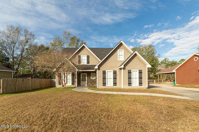 view of front of property with a carport and a front lawn