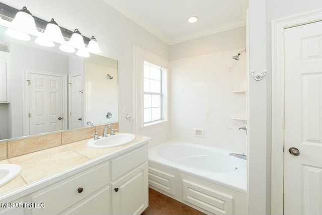 bathroom with a bath, tile patterned flooring, ornamental molding, and vanity