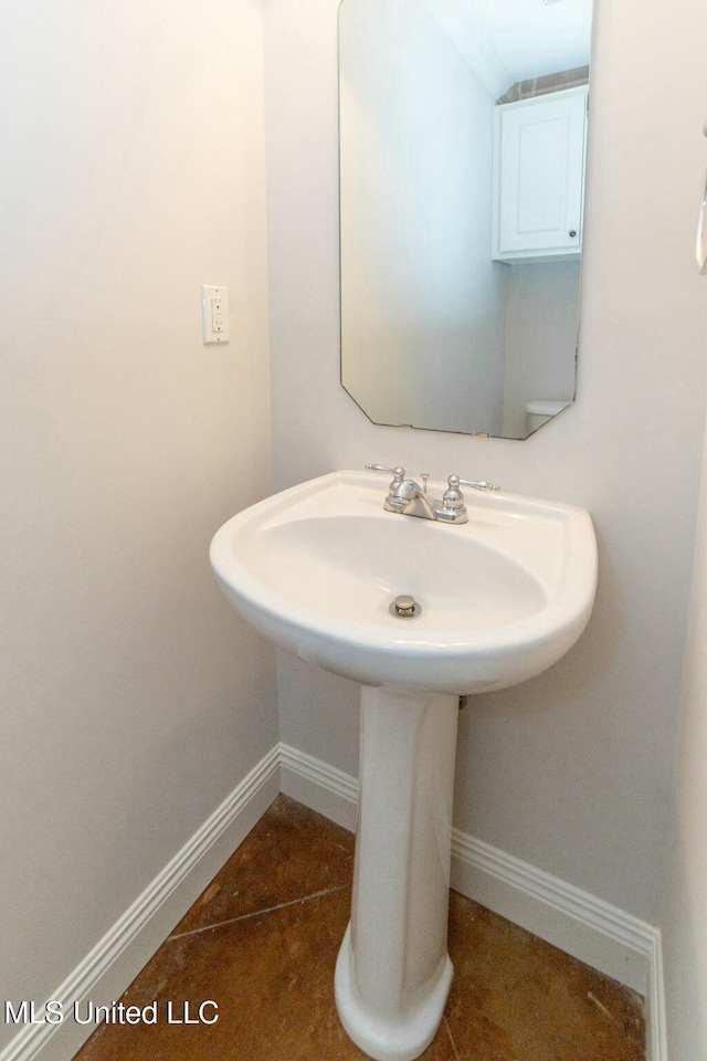 bathroom with tile patterned flooring and sink