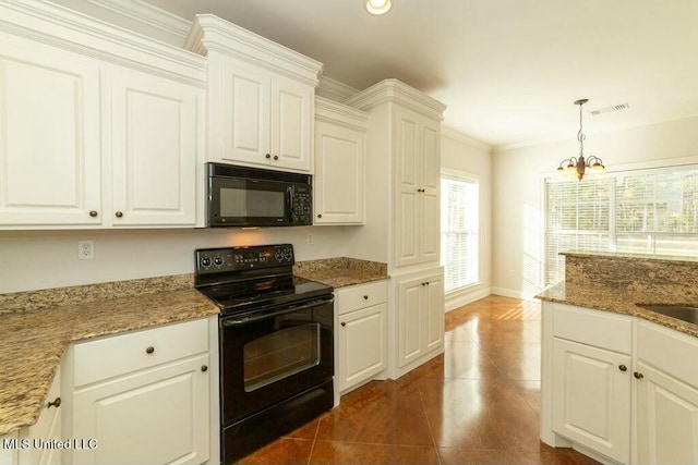 kitchen featuring pendant lighting, white cabinetry, black appliances, and a notable chandelier