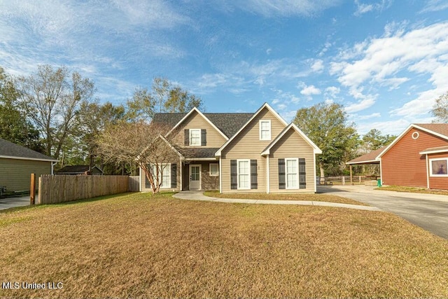 view of front of home featuring a carport and a front yard