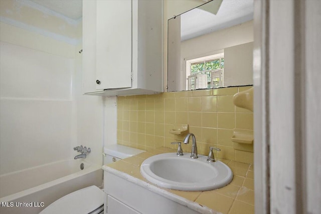 626 N Lexington St, Durant, MS 39063 - full bathroom with tasteful backsplash, vanity, toilet, and  shower combination