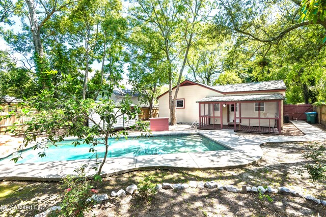 view of pool with a wooden deck