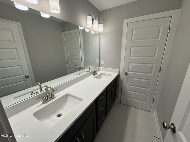 full bath with a sink and double vanity