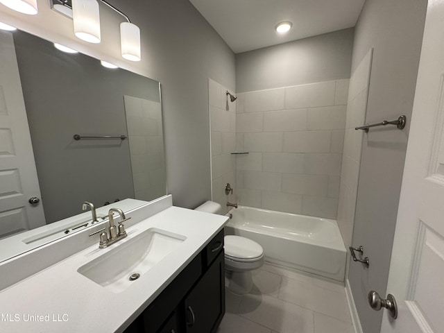 bathroom with tile patterned floors, bathing tub / shower combination, toilet, and vanity