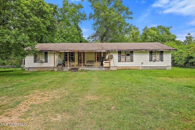3515 Johnson Line Rd, Bolton, MS 39041 - ranch-style home with covered porch, a front lawn, and a trampoline