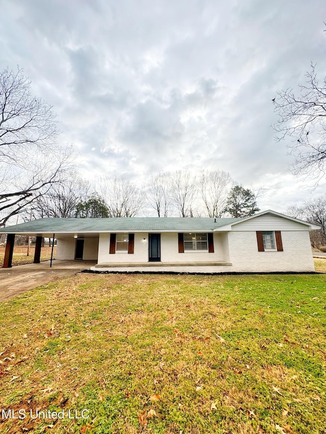 ranch-style home featuring a front yard and a carport