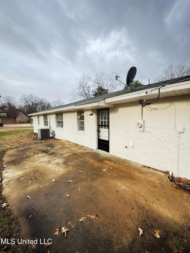 rear view of house with central AC