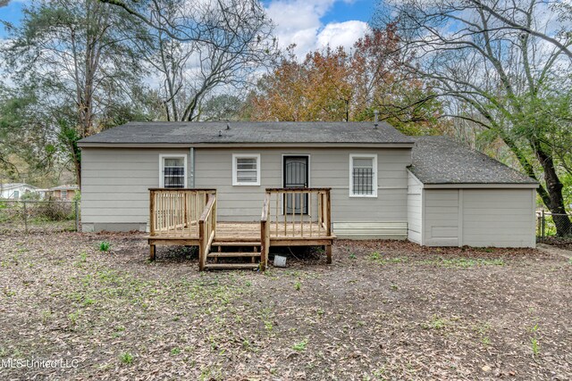 back of house featuring a deck