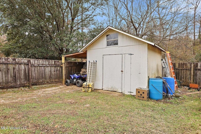 view of outbuilding featuring a lawn